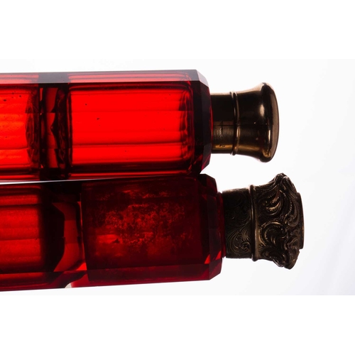 288 - Two Victorian ruby glass double-ended scent bottles; the first has gilt floral terminations, engrave... 