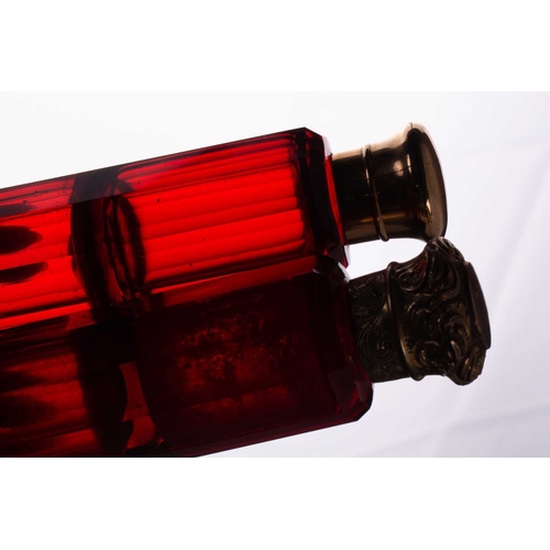 288 - Two Victorian ruby glass double-ended scent bottles; the first has gilt floral terminations, engrave... 