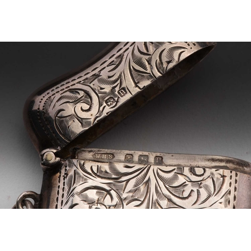 421 - A Victorian silver vesta case; rounded rectangular, foliate engraved, with side hinged opening and s... 