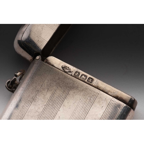 421 - A Victorian silver vesta case; rounded rectangular, foliate engraved, with side hinged opening and s... 