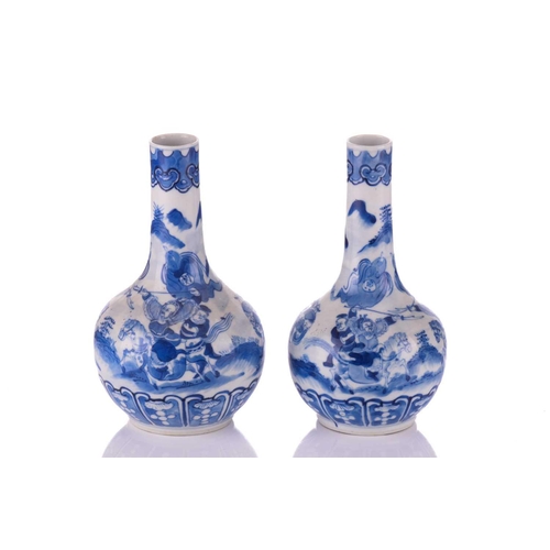 100 - A pair of Chinese blue and white porcelain bottle vases, Qing Dynasty, late 19th century, painted wi... 