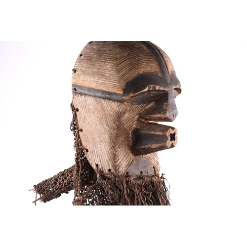 106 - A Songye kifwebe mask, Kikashi, Eastern Songye, Democratic Republic of Congo, with linear carved dec... 