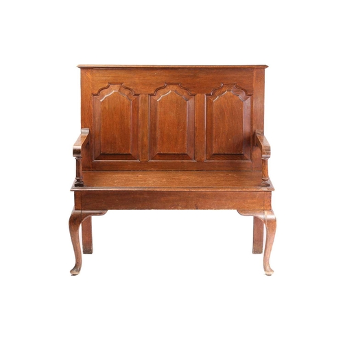 117 - A George II style oak two-seat settle, 1920s, bearing an ivorine trade label for Arthur Newberry (Ca... 