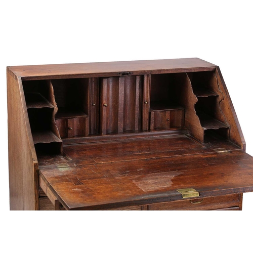 127 - A George I/II oak fall front writing bureau, the interior with concealed drawers and a well. Fitted ... 