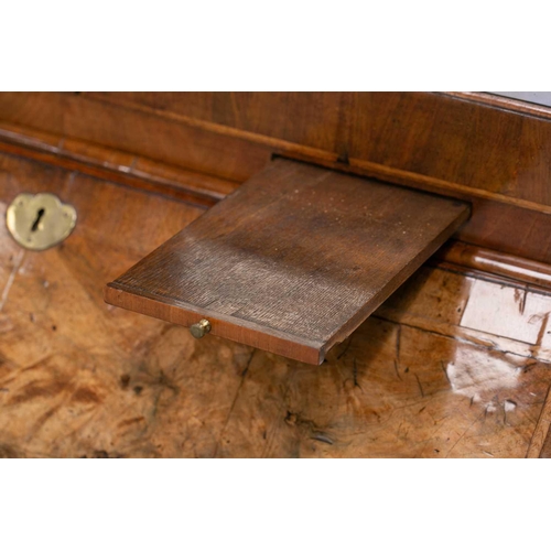 131 - A George I walnut bureau bookcase the upper section with cross-grain cornice above a pair of mirror ... 