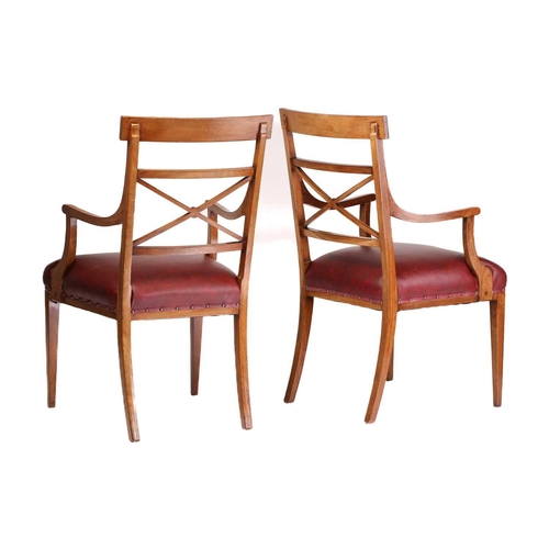 137 - A set of twelve Edwardian mahogany Sheraton revival dining chairs including ten singles and two carv... 