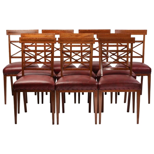 137 - A set of twelve Edwardian mahogany Sheraton revival dining chairs including ten singles and two carv... 