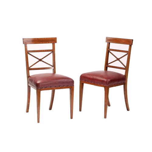 137 - A set of twelve Edwardian mahogany Sheraton revival dining chairs including ten singles and two carv... 