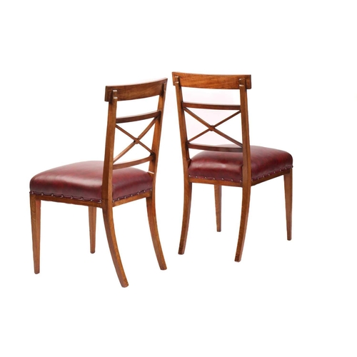 137 - A set of twelve Edwardian mahogany Sheraton revival dining chairs including ten singles and two carv... 