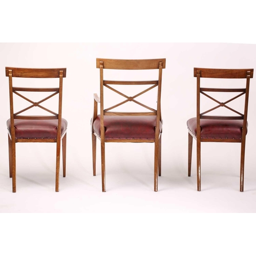 137 - A set of twelve Edwardian mahogany Sheraton revival dining chairs including ten singles and two carv... 