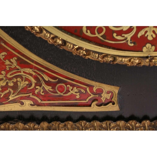 141 - A Victorian ebonized and red tortoiseshell Boulle worked credenza. With a central cupboard door with... 