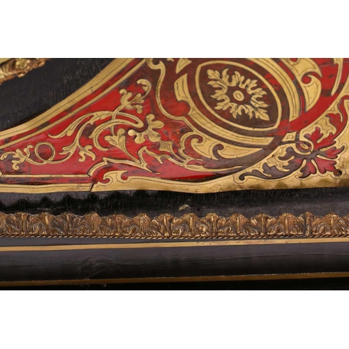 141 - A Victorian ebonized and red tortoiseshell Boulle worked credenza. With a central cupboard door with... 