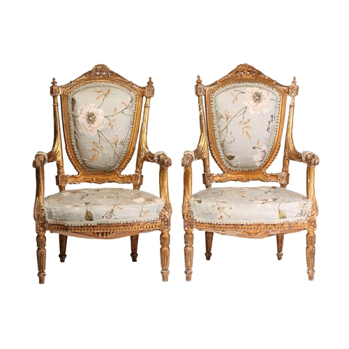 142 - A pair of Louis XVI-style carved wood and gilt gesso fauteuils a la Reine (armchairs) probably late ... 