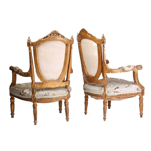 142 - A pair of Louis XVI-style carved wood and gilt gesso fauteuils a la Reine (armchairs) probably late ... 