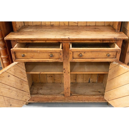 146 - An architectural stripped pine dresser and integral rack, 19th century and later adaptations. With t... 