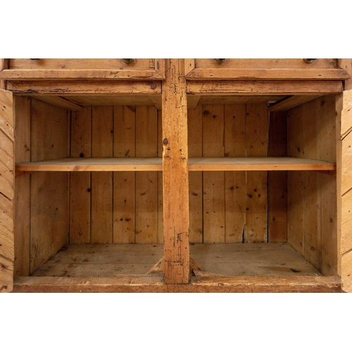 146 - An architectural stripped pine dresser and integral rack, 19th century and later adaptations. With t... 