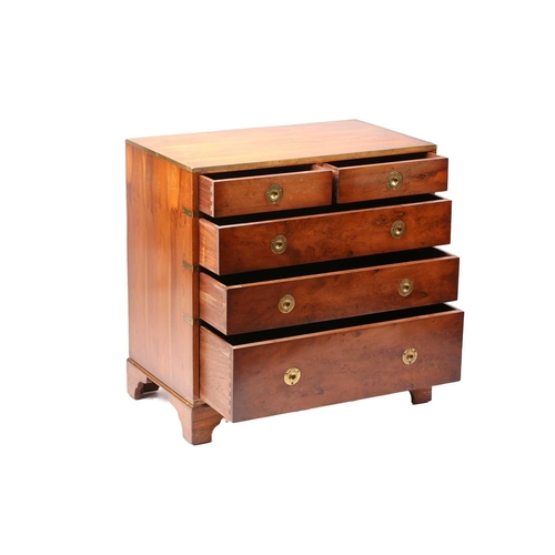 150 - A small good quality yew wood campaign-style chest of drawers with brass banding and recessed ring-p... 