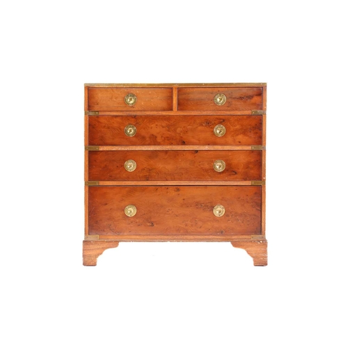 150 - A small good quality yew wood campaign-style chest of drawers with brass banding and recessed ring-p... 