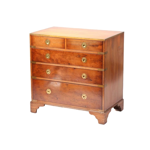 150 - A small good quality yew wood campaign-style chest of drawers with brass banding and recessed ring-p... 