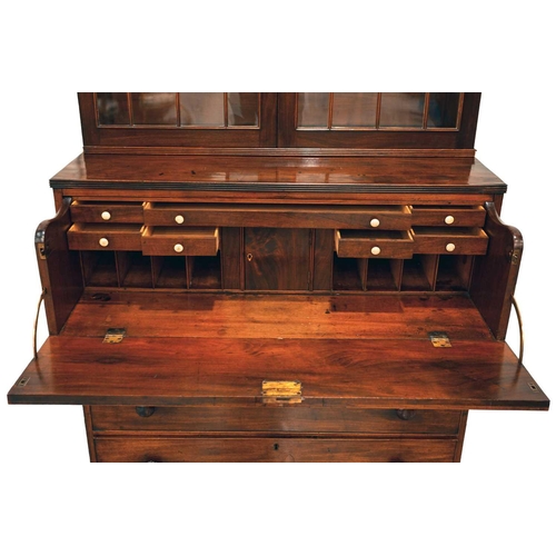 157 - A George IV mahogany secretaire bookcase with astragal glazed upper section enclosing adjustable she... 