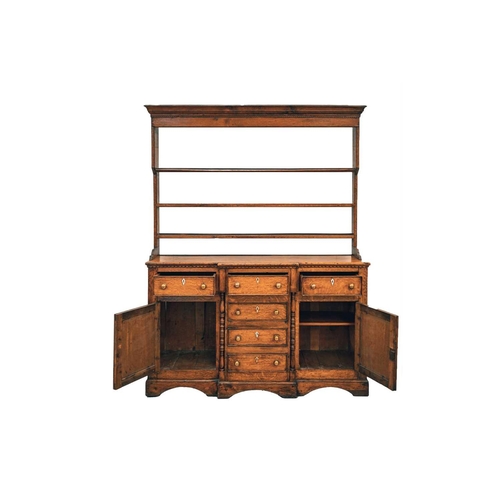 159 - A 19th-century Welsh (probably Anglesey) oak and deal breakfront base dresser and rack, with three f... 