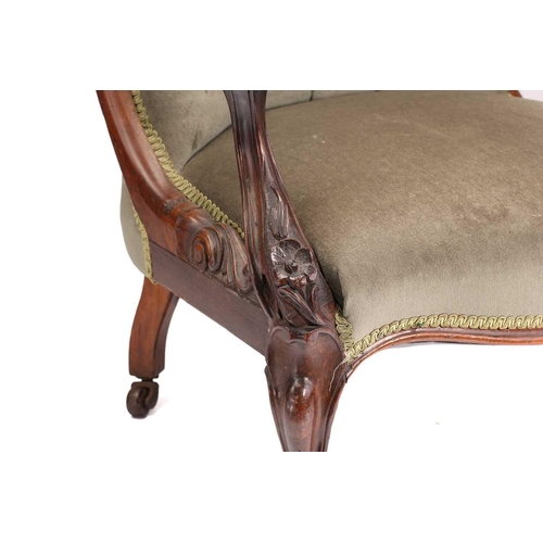 162 - An early Victorian figured rosewood scroll back open armchair on carved cabriole legs with brass swi... 