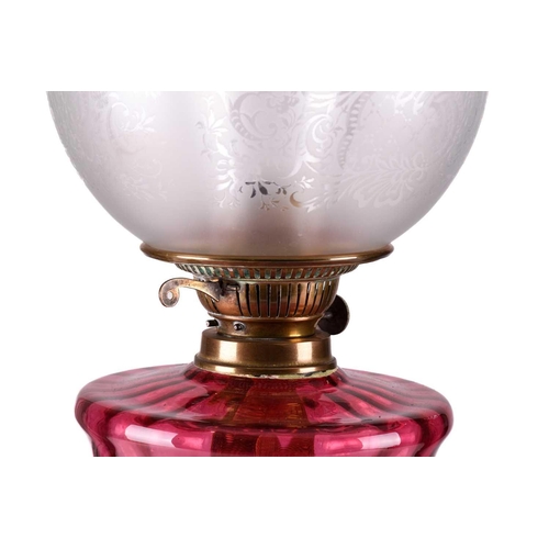 167 - A Victorian pillar duplex oil lamp with cranberry glass reservoir oil lamp with acid frosted diffuse... 