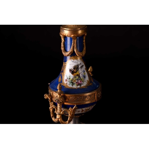 171 - A small french Napoleon III patinated bronze and ormolu mantle clock with a surmount in the form of ... 