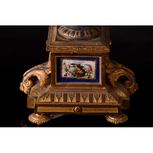 171 - A small french Napoleon III patinated bronze and ormolu mantle clock with a surmount in the form of ... 