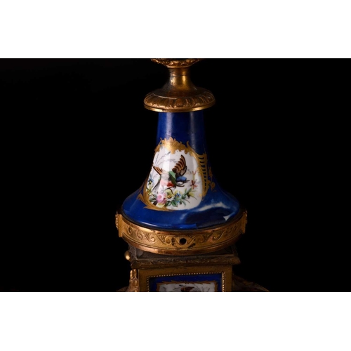 171 - A small french Napoleon III patinated bronze and ormolu mantle clock with a surmount in the form of ... 