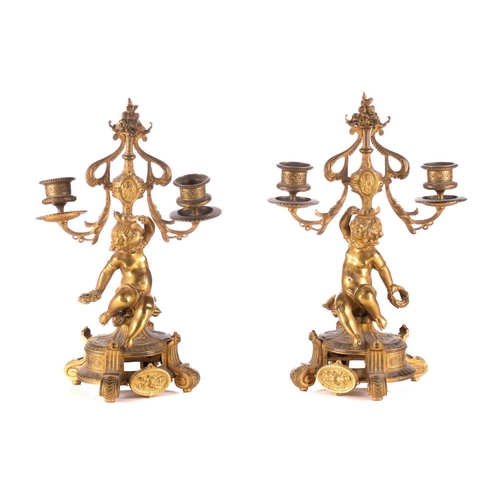 172 - A late 19th century Henry Marc of Paris 8-day ormolu clock garniture with figural surmounts of a pai... 