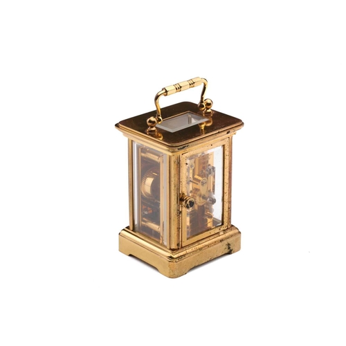 174 - A Matthew Norman miniature brass four-glass carriage clock, in fitted case with original paperwork.