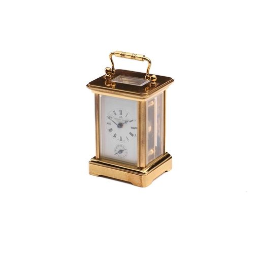 174 - A Matthew Norman miniature brass four-glass carriage clock, in fitted case with original paperwork.