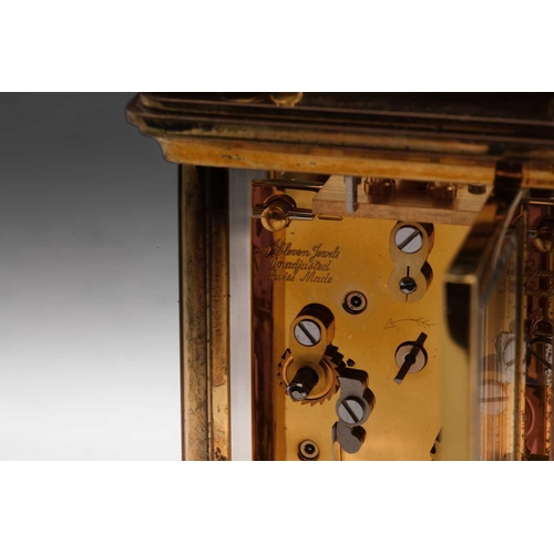 174 - A Matthew Norman miniature brass four-glass carriage clock, in fitted case with original paperwork.