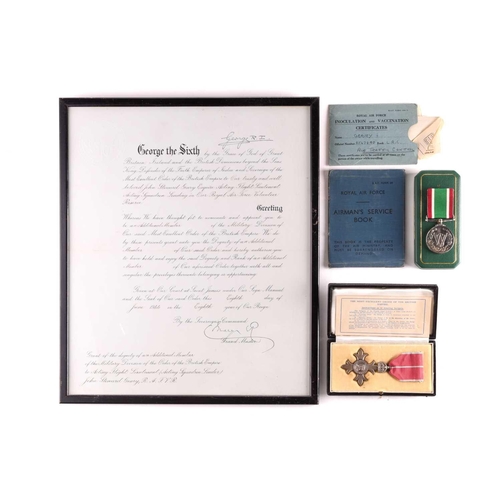 192 - A King George VI & Queen Mary signed OBE document, framed, together with a Royal Mint cased MBE meda... 