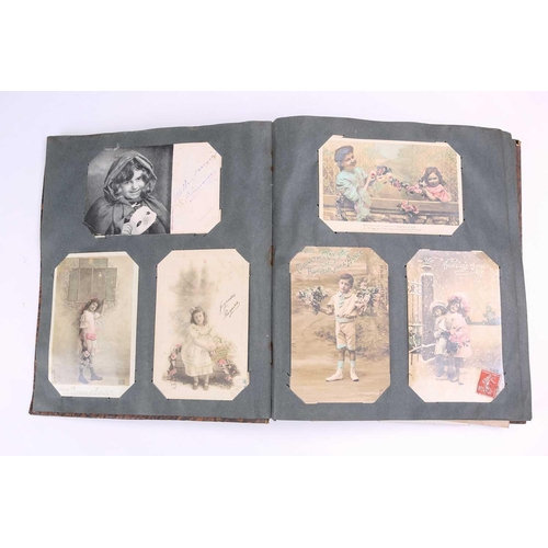 197 - A vintage postcard album containing many colour and sepia postcards including Mabel Lucy Attwell, Ma... 