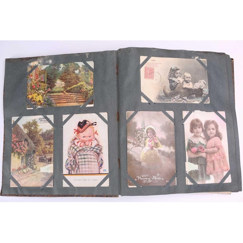 197 - A vintage postcard album containing many colour and sepia postcards including Mabel Lucy Attwell, Ma... 