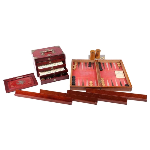 199 - A Chinese early 20th century cased bamboo and bone Mahjong set with tile trays marked for the geogra... 