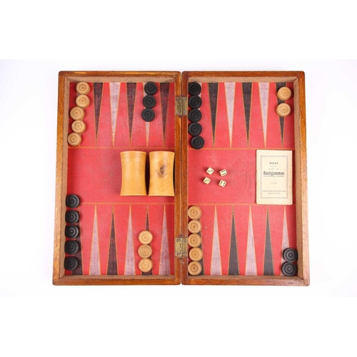 199 - A Chinese early 20th century cased bamboo and bone Mahjong set with tile trays marked for the geogra... 