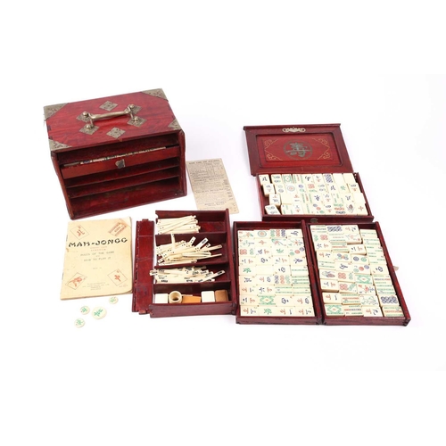 199 - A Chinese early 20th century cased bamboo and bone Mahjong set with tile trays marked for the geogra... 