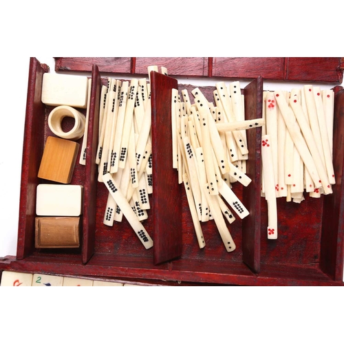 199 - A Chinese early 20th century cased bamboo and bone Mahjong set with tile trays marked for the geogra... 