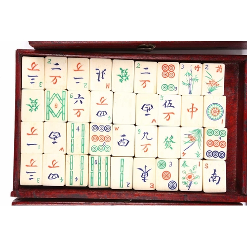 199 - A Chinese early 20th century cased bamboo and bone Mahjong set with tile trays marked for the geogra... 