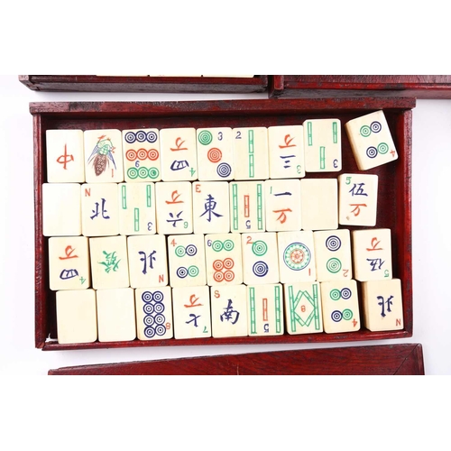 199 - A Chinese early 20th century cased bamboo and bone Mahjong set with tile trays marked for the geogra... 