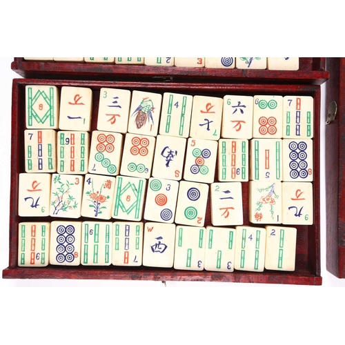 199 - A Chinese early 20th century cased bamboo and bone Mahjong set with tile trays marked for the geogra... 