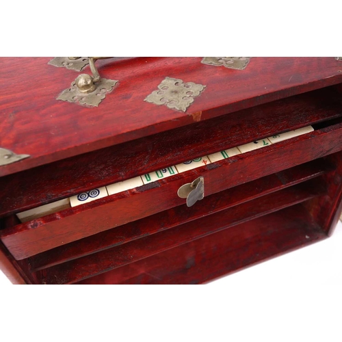 199 - A Chinese early 20th century cased bamboo and bone Mahjong set with tile trays marked for the geogra... 