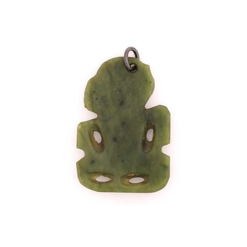 205 - A New Zealand Maori Tiki greenstone pendant, likely 19th century, with tilting head, red wax eyes an... 