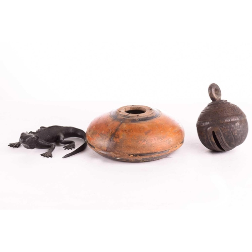 206 - Four Burmese sprung brass Lahta bracelets, a modern bronze lizard, 13cm; a large cow bell, a turned ... 