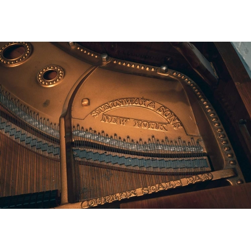 210 - A Steinway of New York baby grand piano No 212527 (1922) with rosewood case. The cast iron inner fra... 