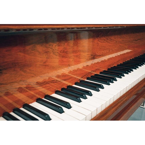 210 - A Steinway of New York baby grand piano No 212527 (1922) with rosewood case. The cast iron inner fra... 