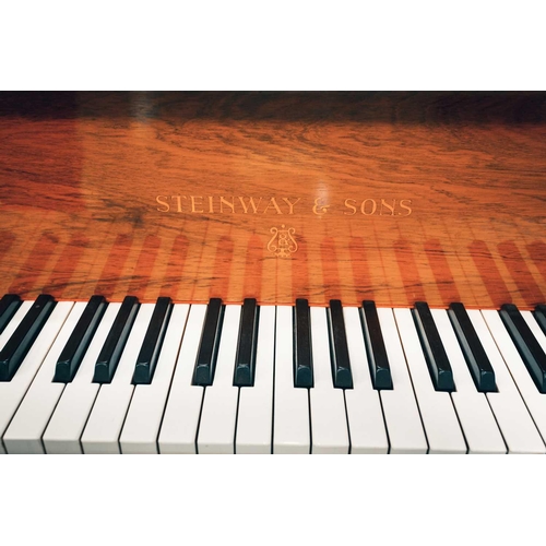 210 - A Steinway of New York baby grand piano No 212527 (1922) with rosewood case. The cast iron inner fra... 